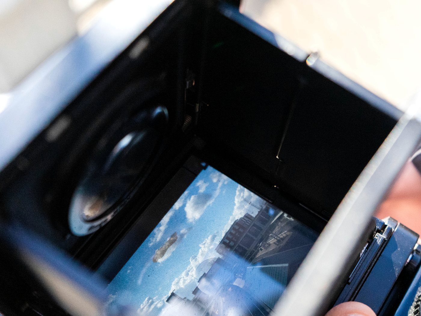 A film camera brought in for a valuation, its viewfinder open